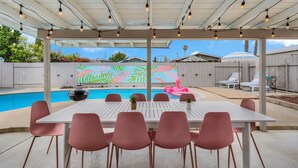 An outdoor patio with a pool, a covered seating area, and a colorful mural in the background. - Girls  & Family Trip+Pool+beauty bar, San Diego (La Mesa)