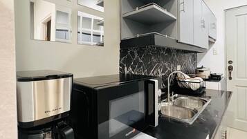 Fridge, microwave, stovetop, cookware/dishes/utensils