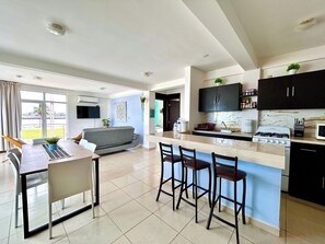 Family Apartment, Multiple Beds, Balcony, Sea View | In-room dining