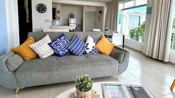 Family Apartment, Multiple Beds, Balcony, Sea View | Living room | TV