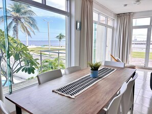 Family Apartment, Multiple Beds, Balcony, Sea View | In-room dining