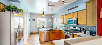 Southwestern home with hot tub, large yard, grill, & gas fireplace