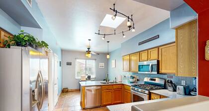 Southwestern home with hot tub, large yard, grill, & gas fireplace