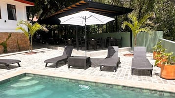 Outdoor pool, pool umbrellas, pool loungers