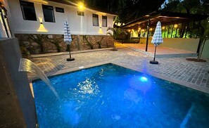 Outdoor pool, open 9:00 AM to 9:00 PM, pool umbrellas, pool loungers