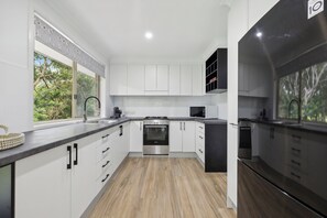 Fridge, microwave, oven, stovetop - Boronia Oasis Creek front Villa in the Heart of Sawtell (SAWTELL)