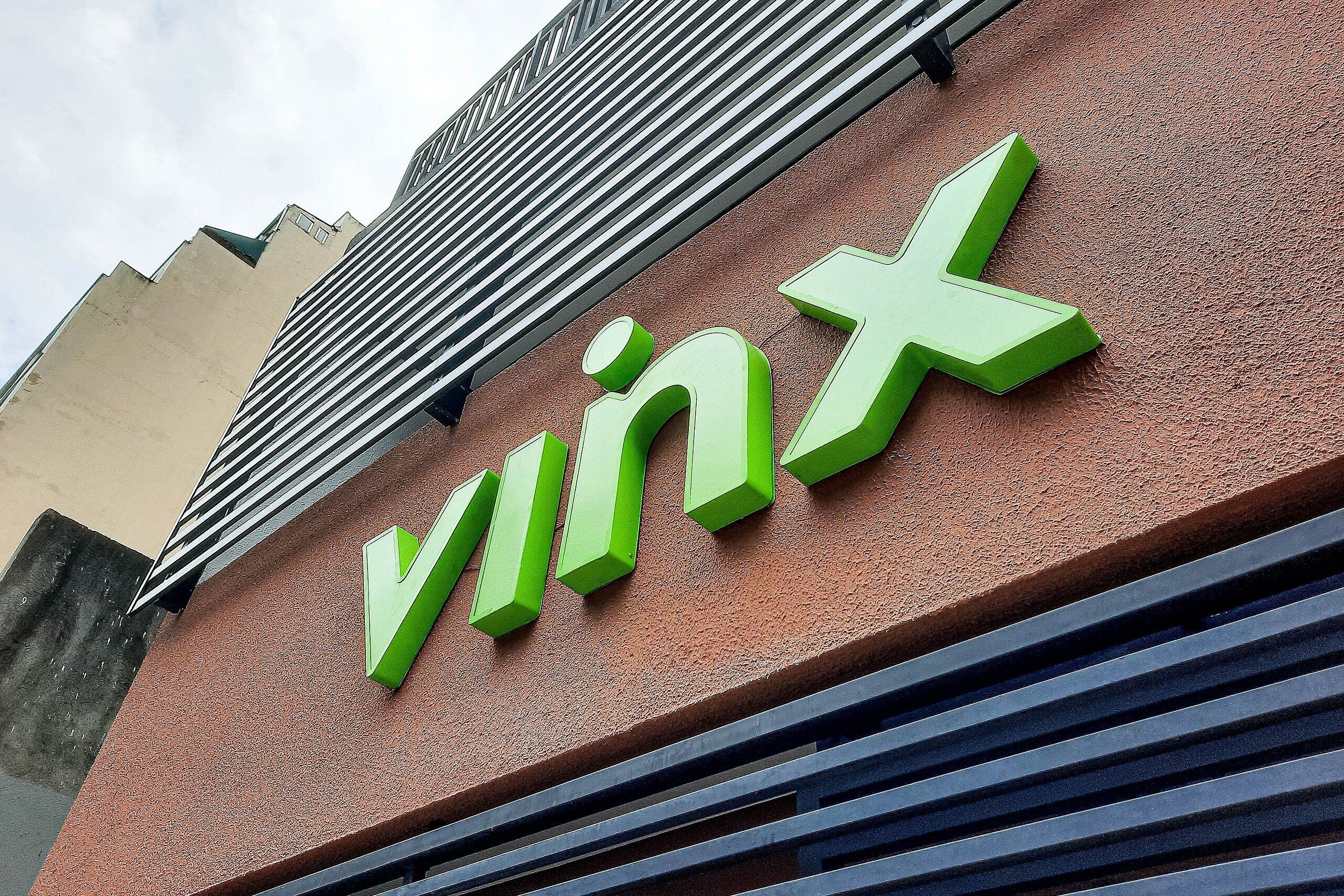 A building with a prominent 'Vinx' sign on a textured wall.