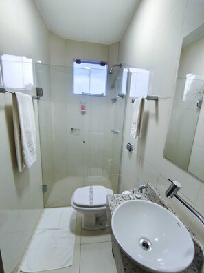 Shower, towels, soap, toilet paper