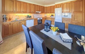 Fridge, stovetop, dishwasher, coffee/tea maker