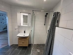 Shower, towels, soap, toilet paper