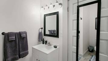 Shower, hair dryer, towels, shampoo