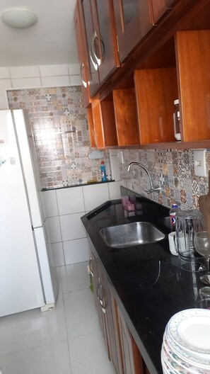 Private kitchen - Apartment located in a fully equipped residential neighborhood, great leisure area (São Luís)