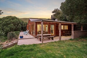 Relax on the spacious deck with large windows and enjoy the serene surroundings.