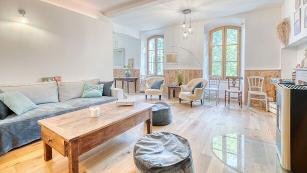 A spacious living area with a sofa, coffee table, and chairs, a dining table with chairs, and a kitchen area with a refrigerator. - Holiday Home 'Maison Avec Piscine Et Remous' with Private Pool, Terrace and Wi-Fi (Revel)