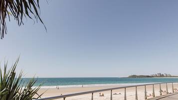 Stroll along the beachside promenade with a clear view of the ocean.