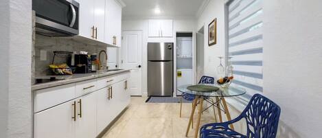 Fridge, microwave, stovetop, coffee/tea maker