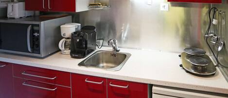 Fridge, microwave, cookware/dishes/utensils
