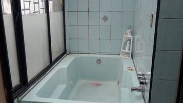 Jetted tub, hair dryer, towels, soap