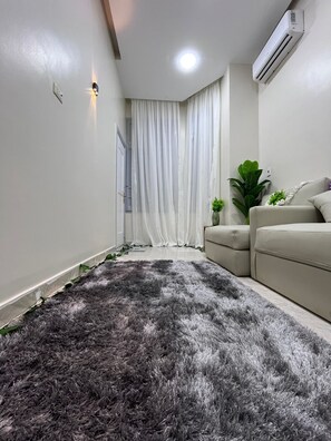 Family Apartment, Balcony, City View | Living area | 50-inch plasma TV with satellite channels, fireplace, pay films - New royai studio (Cairo)