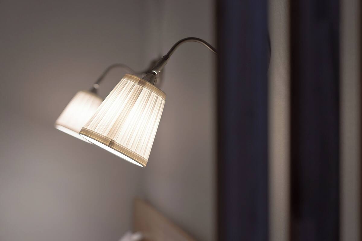 A wall-mounted lamp with a cord.
