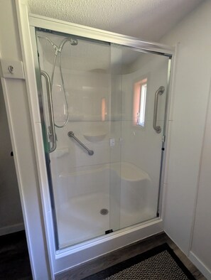 Shower, hair dryer, towels, toilet paper