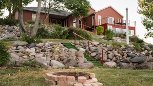 A house with a stone staircase, a fire pit, and a grassy area. - The Lakeside Retreat (Aberdeen)