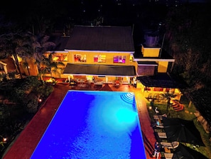 Outdoor pool, pool umbrellas, lifeguards on site