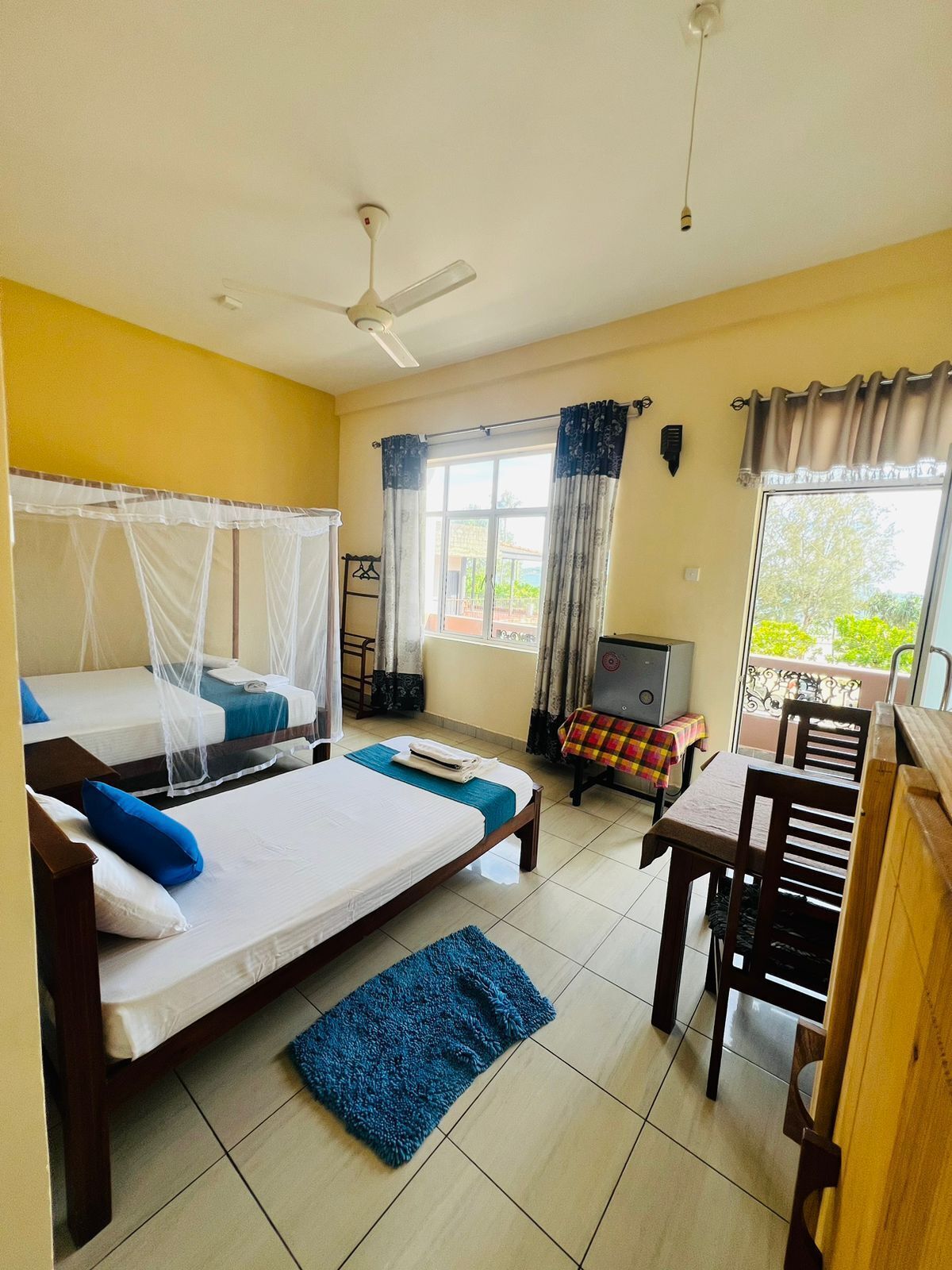Deluxe Triple Room, Balcony, Beach View | Individually furnished, desk, laptop workspace, free WiFi
