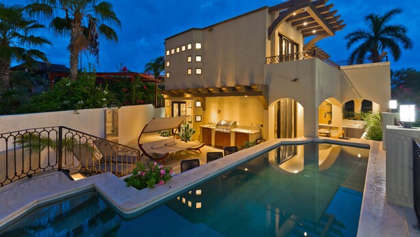 A modern house with a swimming pool, outdoor seating, and a kitchen area. - Casa Famlee - Duplex House(sleeps 8) with Pool & Hot Tub in Cabo San Lucas! (Cabo Bello)