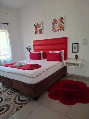 Deluxe Double or Twin Room, Patio, Garden View | Desk, laptop workspace, soundproofing, iron/ironing board - Shalakwe Hills-Inn Guesthouse (Kasane)