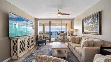 Signature Condo, 3 Bedrooms, Balcony, Beach View | Living room | 65-inch Smart TV with cable channels