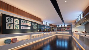 A modern hotel lobby with a long reception desk, a wall with various signs, and a clean, polished floor. - Li Gao Exclusive Hotel (Changsha)
