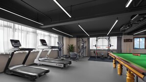 A gym with treadmills, a pool table, and weightlifting equipment. - Li Gao Exclusive Hotel (Changsha)