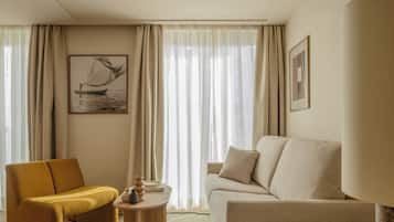 Deluxe Apartment, City View | Living area | TV