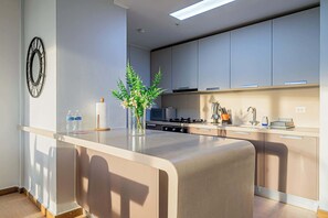 Fridge, microwave, stovetop, coffee/tea maker