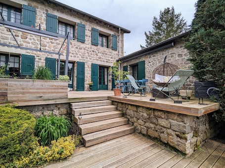 Outdoor dining. Farmhouse with indoor pool on large estate