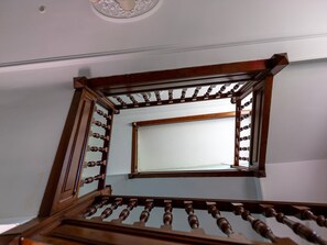 A wooden staircase with a handrail and a mirror reflecting the ceiling. - Jonquille Room with private entrance and pets allowed (Sapois)