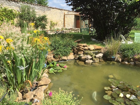 Property grounds. Charming house in orchard heart with fireplace, secret garden and children's games