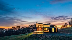 A modern house with large glass windows, a flat roof, and a view of the surrounding landscape. - Mountain Top Bilpin, Studio 2 (Bilpin)