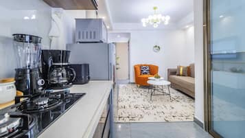 Deluxe Apartment, Balcony, City View | Living area | 24-inch Smart TV with digital channels