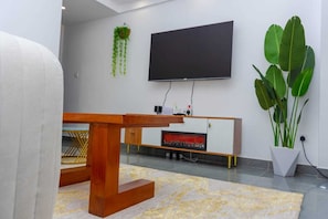 Elite Apartment | Living area | 24-inch Smart TV with digital channels - Lux Suites Winchester Gardens Riverside (Nairobi)