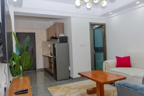 Elite Apartment | Living area | 24-inch Smart TV with digital channels - Lux Suites Winchester Gardens Riverside (Nairobi)