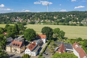A residential area with houses, a tower, and a large open field. - apartment for 4 people with kitchen & balcony, view of the Elbe & free Wi-Fi (Dresden)