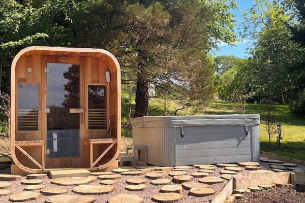 The outdoor sauna and hot tub. Nightly rate includes 2 x 75 mins private use.