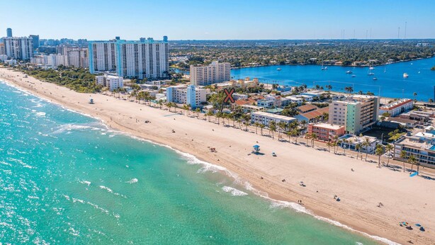 A coastal cityscape with a beach, high-rise buildings, and a marina. - Southwinds Beach House • Jacuzzi • Sleeps 8 (Hollywood)