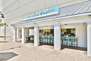 Enjoy a sheltered dining experience at Sunshine Grill, with outdoor seating and a bar area.