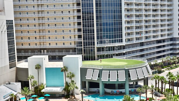 A hotel with a large pool area, multiple balconies, and a modern architectural design. - Ocean View 1BR 2BA @ Fully Loaded Resort! (Panama City Beach)