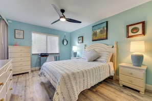 A bedroom with a bed, dresser, nightstand, and ceiling fan. - Walk to Beach & Bites! St Augustine Resort Condo (St. Augustine)