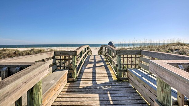 A wooden boardwalk leading to a beach with a clear sky. - Walk to Beach & Bites! St Augustine Resort Condo (St. Augustine)