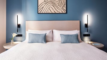 Large Room with Living Area | Seprai premium, busa memori, minibar, dan brankas
